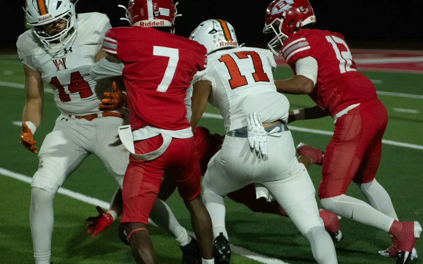 American football players competing during a game on the field